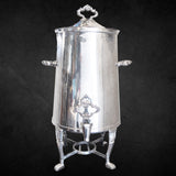 Large Silverplate Coffee Beverage urn with floral spout handles and finial with black background